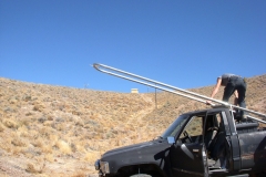 pickup with pole raising rig below Shack